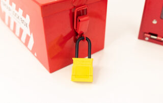 Group lock box with yellow controls padlock attached